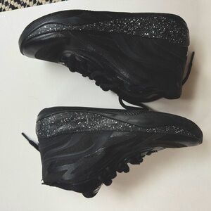 Kid size 5 1/2 Puma M.E.L.O shoes in black.